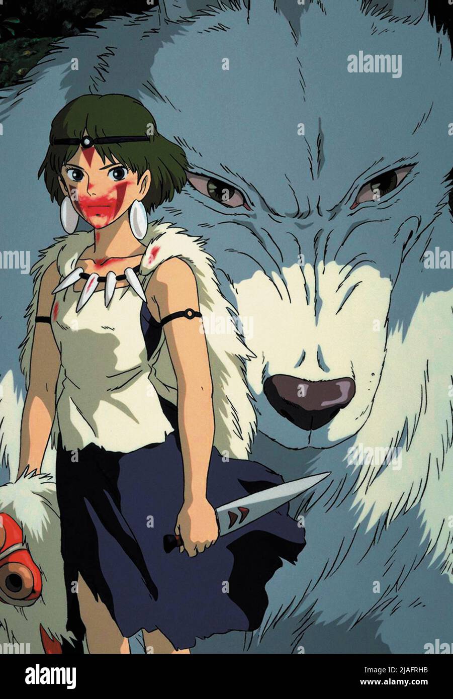 San stands beside a white wolf in Princess Mononoke.